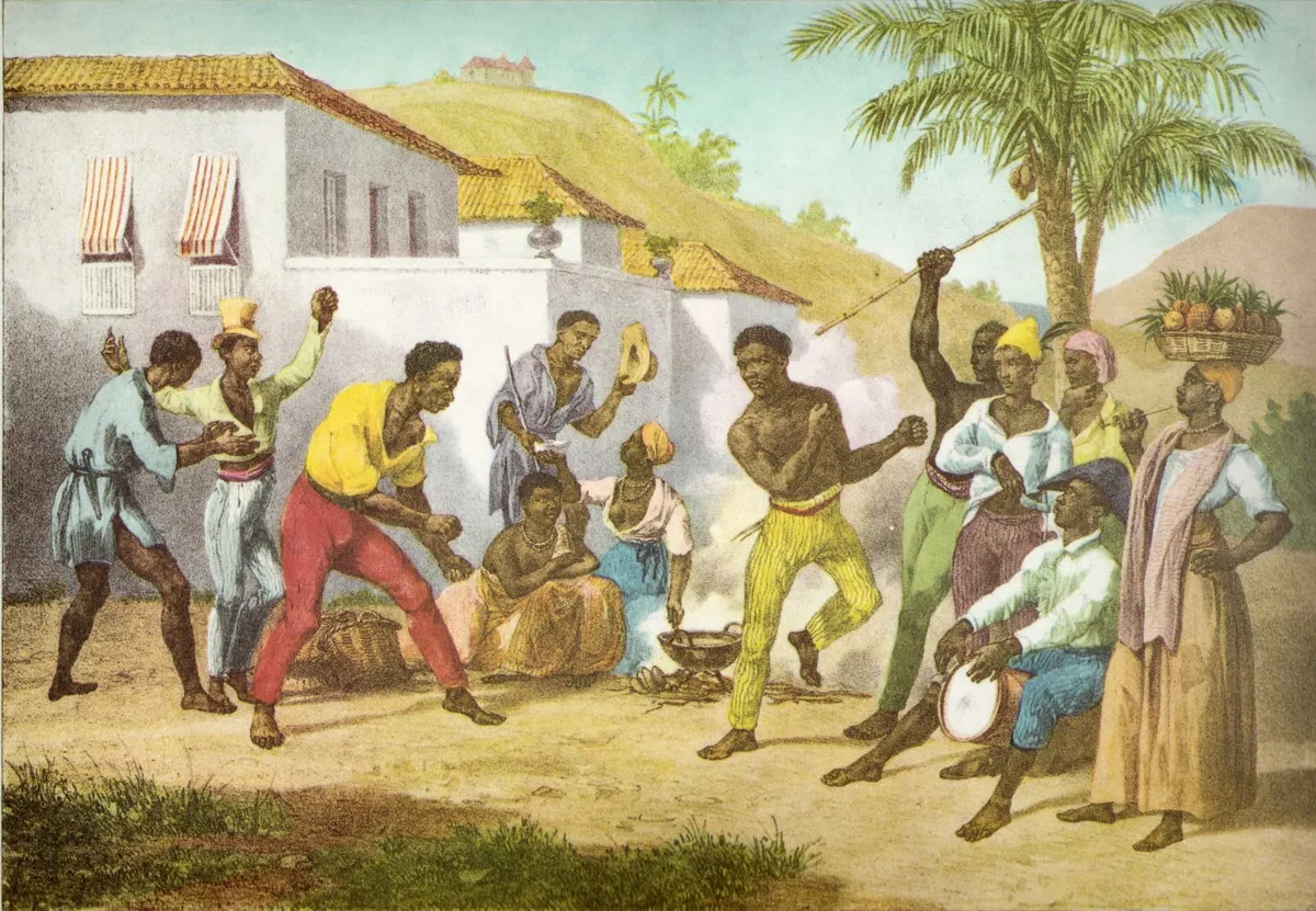 Litografia de Rugendas: capoeiristas jogam em uma rua do Rio de Janeiro do início do século XIX, ao som de um tambor, rodeados por espectadores